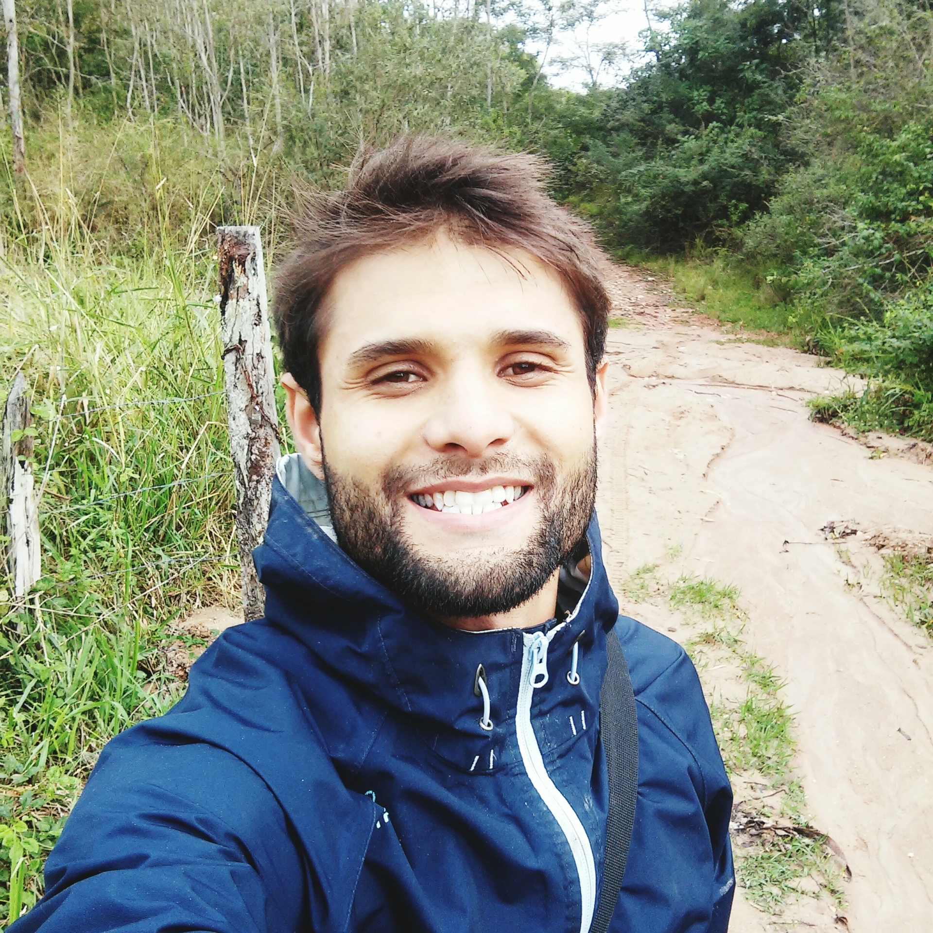 high-angle-portrait-smiling-man-against-plants